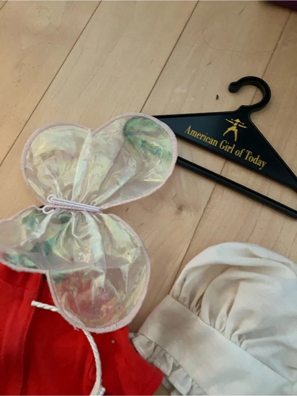 American Girl Doll Hanger with Iridescent Wings and Red Outfit